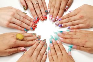 Female hands with various nail arts